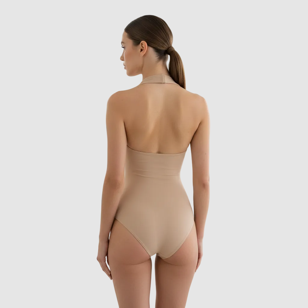 Back view, slim female model, 24 years old, light-medium skin, brown hair in ponytail, nude halter sculpt bodysuit, high waist at natural waistline, smooth compression fabric, studio lighting, white luxury interior, photorealistic, 1:1. same model as previous render. 